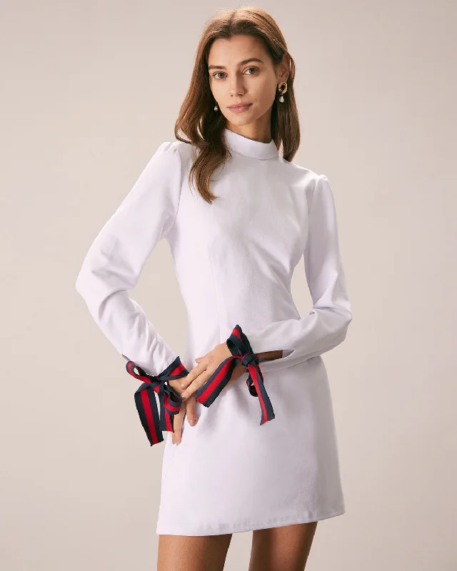 Women’s leather wrap dresses for edgy look -The White Mock Neck Bowknot Cuff Mini Dress